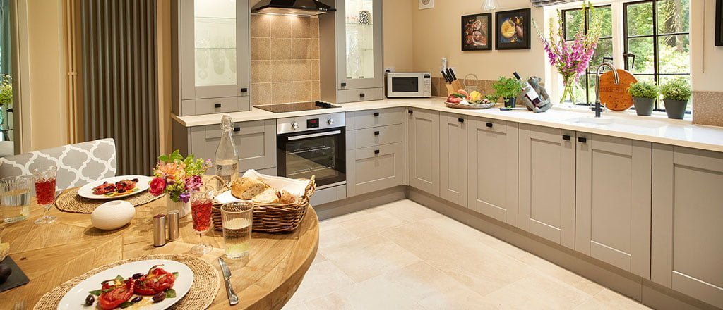 Pink Cottage Kitchen interior is modern and clean with a dining table.